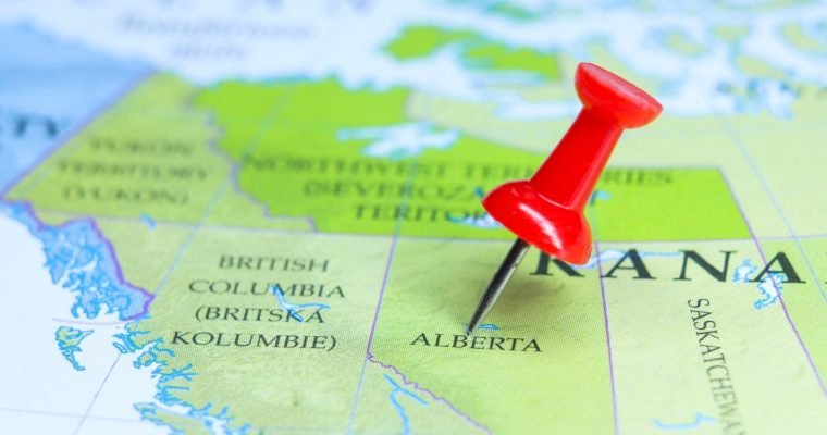 Red pushpin on Alberta map highlighting BetMGM's market expansion into Canadian province